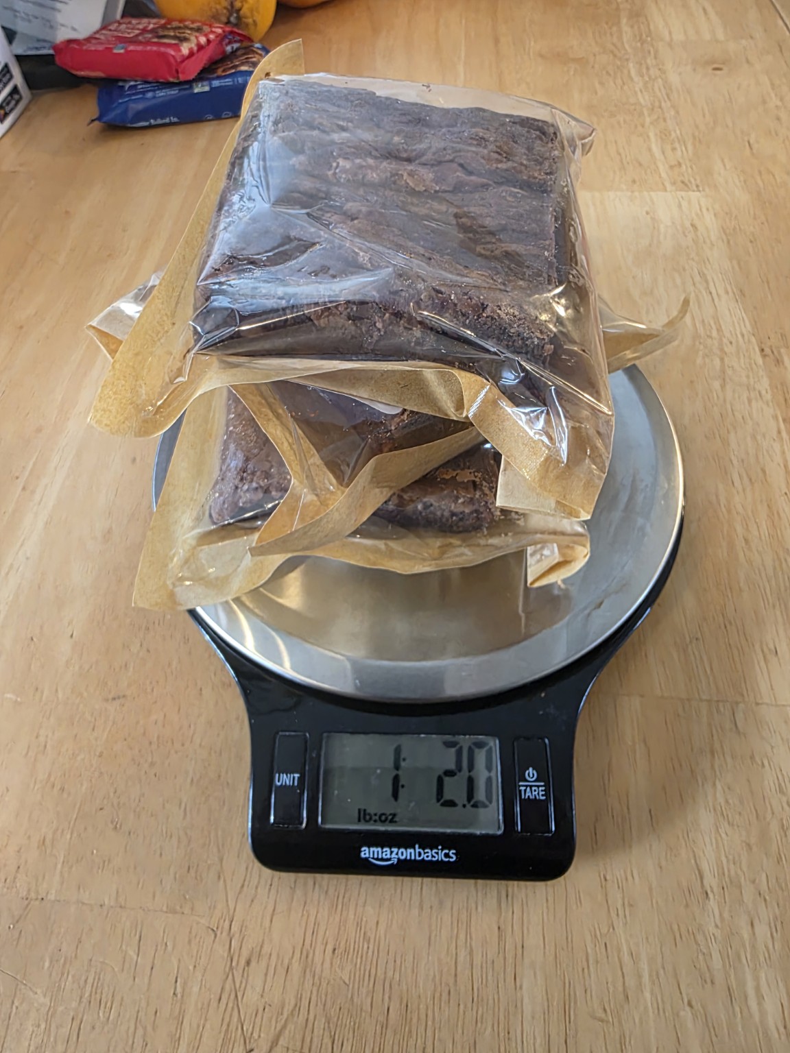 Packaged Bad Influence Bakery Dulce de Leche brownies on a scale