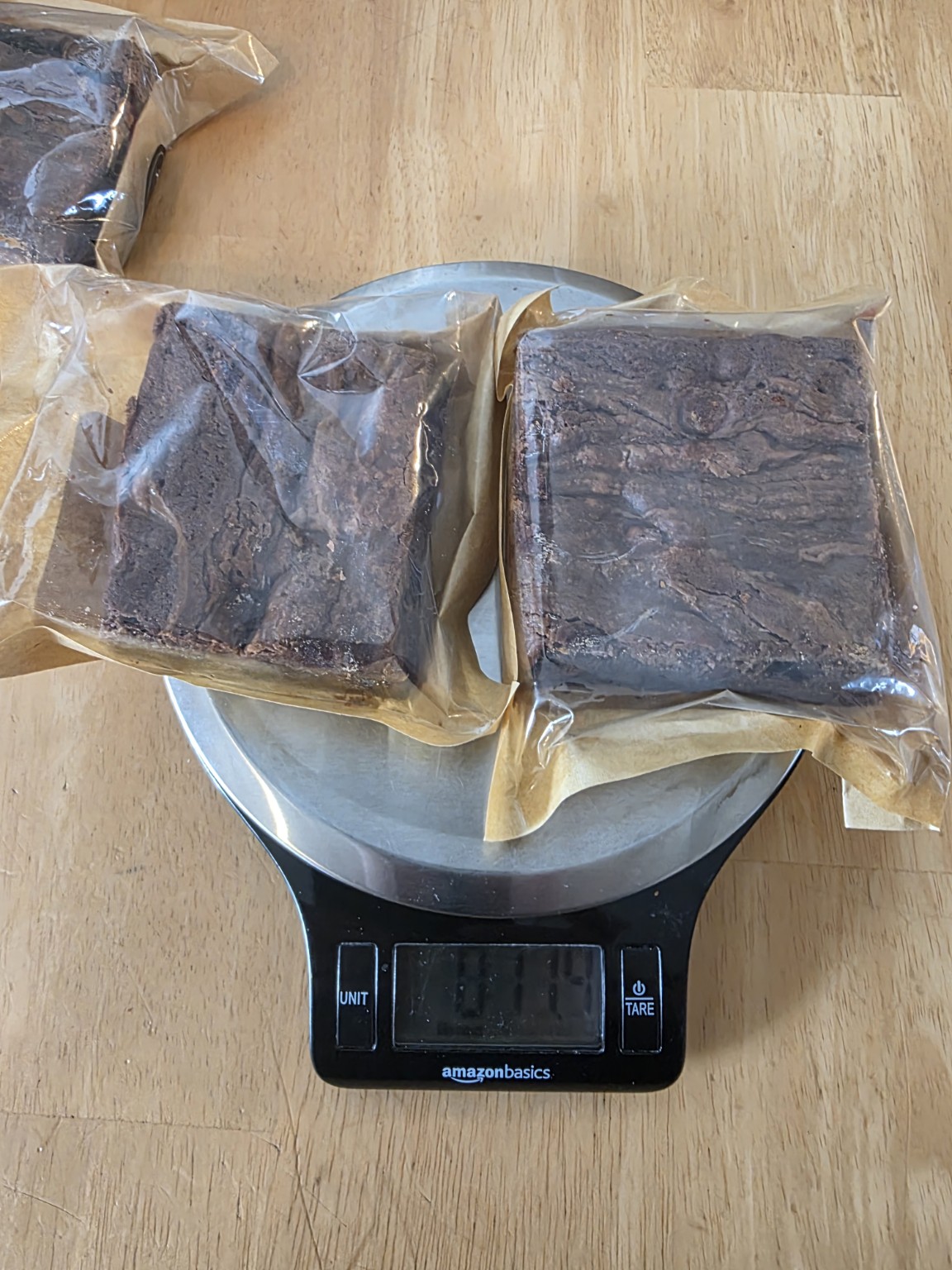 Close view of packaged Bad Influence Bakery Dulce de Leche brownies on a scale