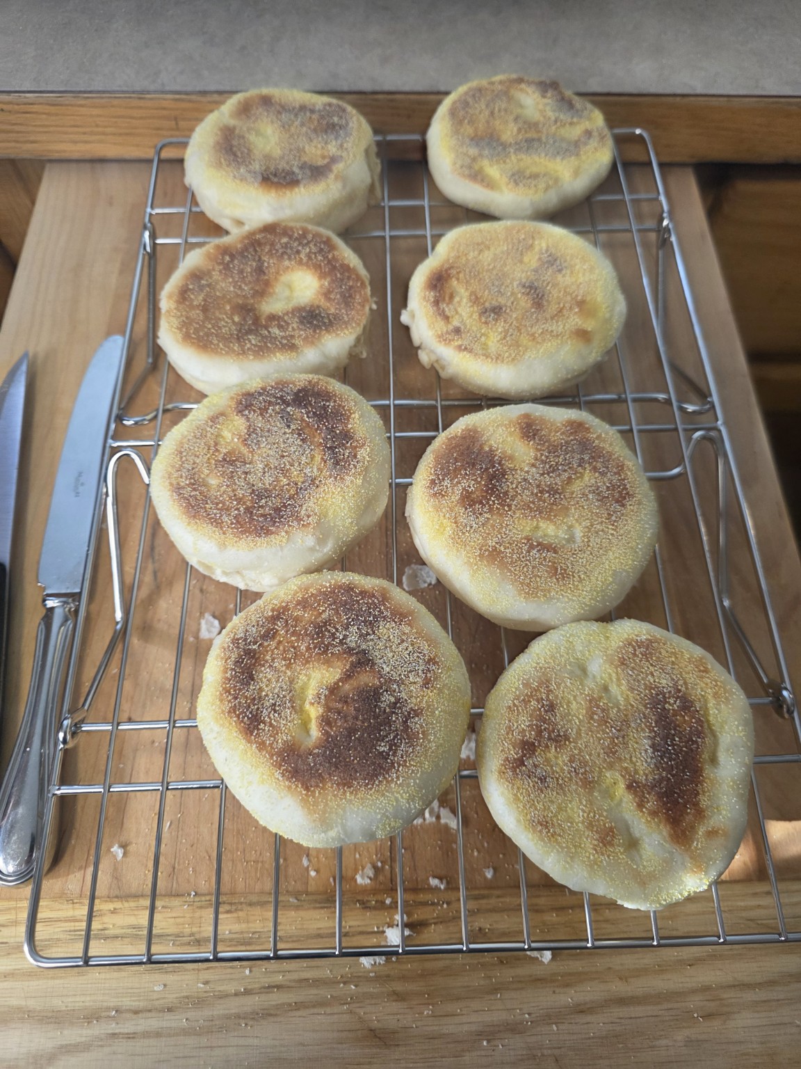 Bad Influence Bakery homemade English muffins cooling on a rack